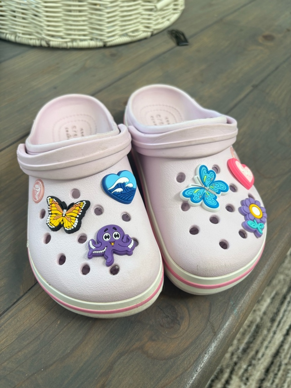 Girls size 13 band crocs in a purple pink color hobbits are new